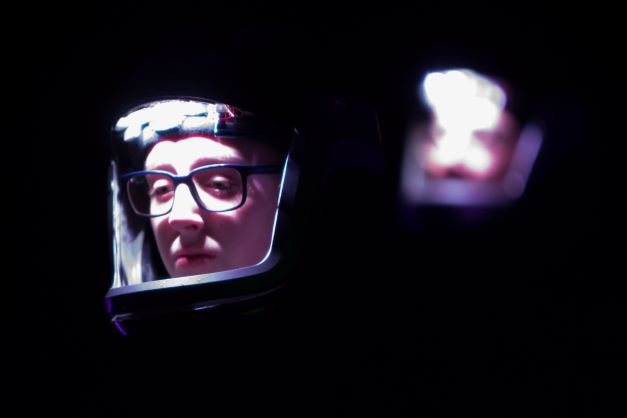Two Actors illuminated only by their helmet lights